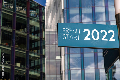 Fresh Start 2022 sign in front of city skyscrapers