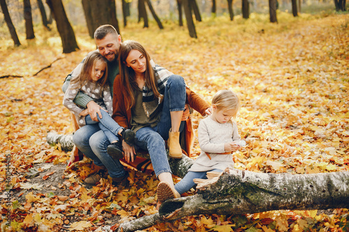 Family with cute kids in a autumn park