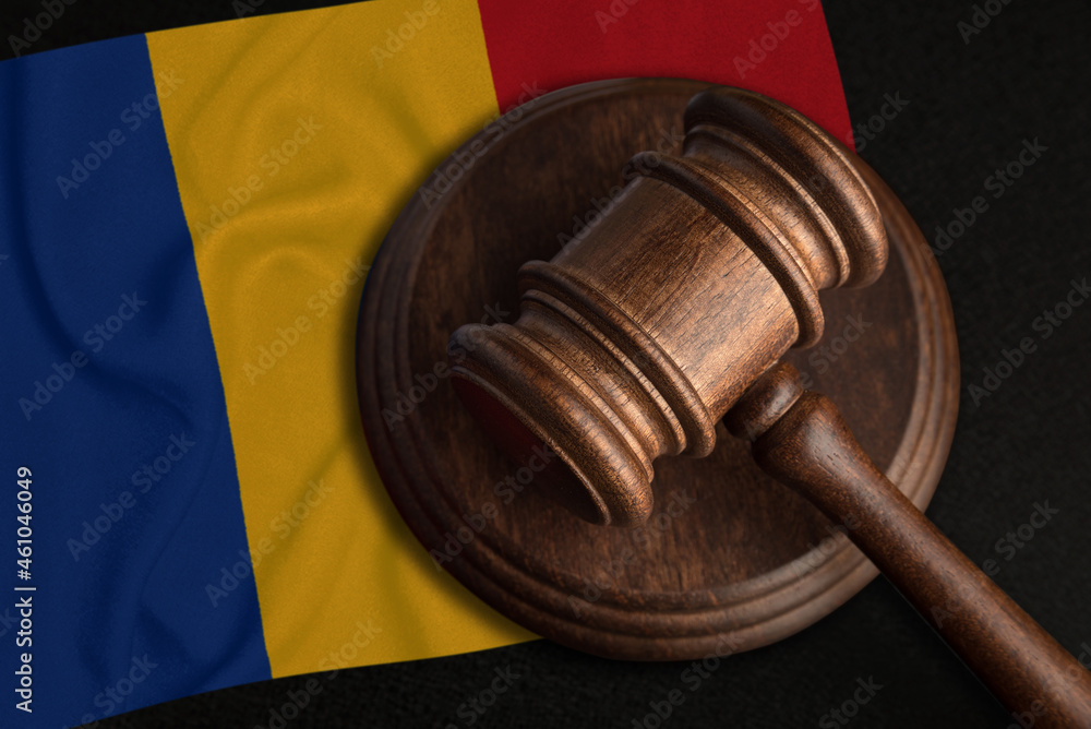 Judge Gavel and flag of Romania. Law and justice in Romania. Violation of rights and freedoms