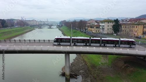 Firenze, viabilità di auto e tram sul ponte delle Cascine.
Vista aerea zenitale ripresa dal drone. photo