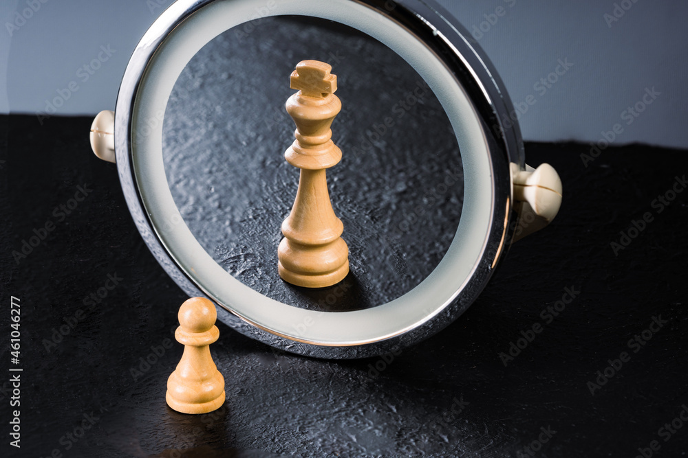 Pawn who sees himself king in the mirror Stock Photo Adobe Stock