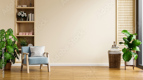 Fototapeta Naklejka Na Ścianę i Meble -  Modern minimalist interior with an armchair on empty cream color wall background.