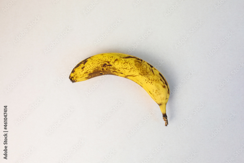 ripe banana on a white background, in the middle, top view