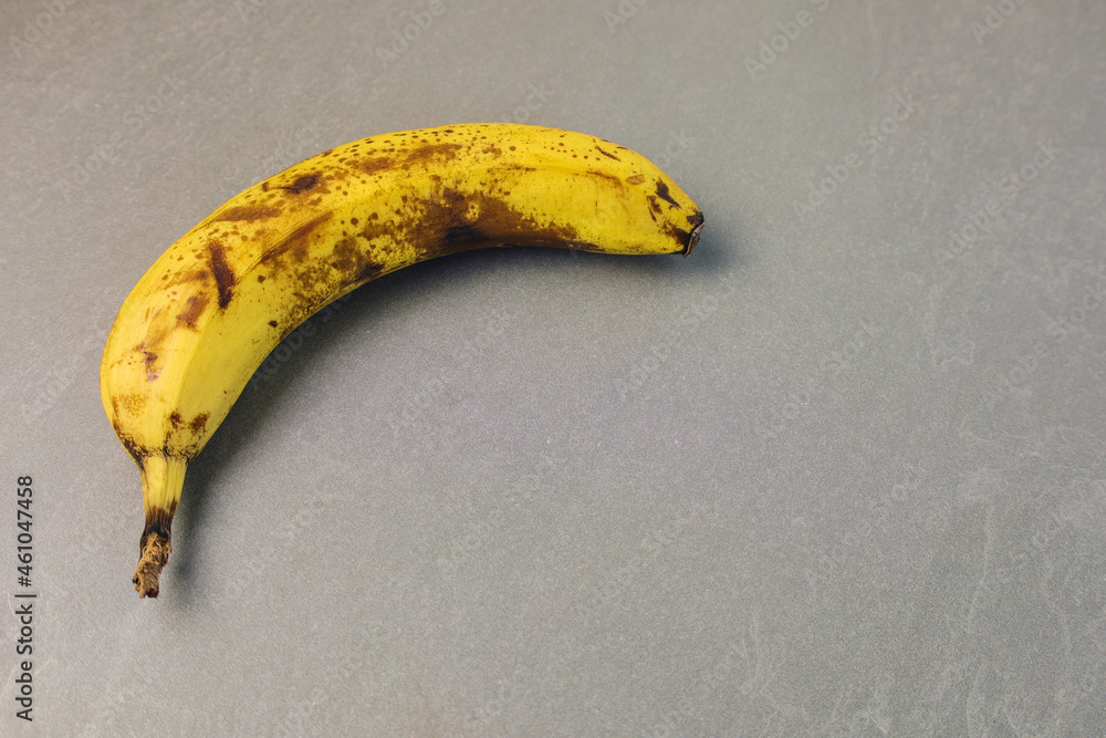 banana on the grey stone table, copy space banana on the grey stone table, copy space