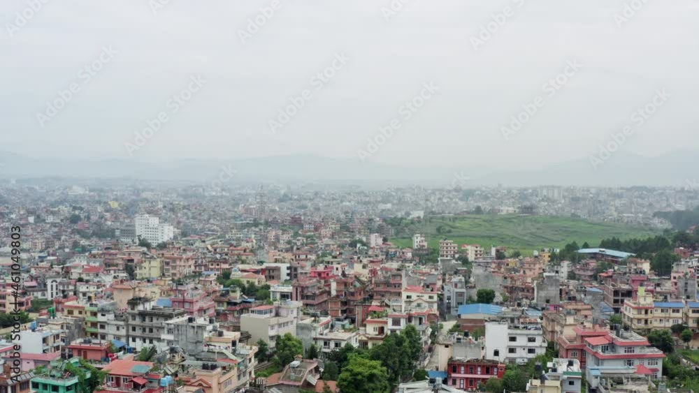Aerial view Kathmandu Nepal.Asian metropolis in Smok, houses and streets with traffic in the capital. Aerial view Kathmandu Nepal.Asian metropolis in Smok, houses and streets with traffic in the capital.