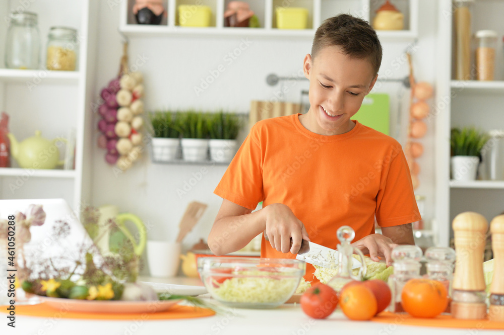 Portrait of cute little boy preparing salad Portrait of cute little boy preparing salad