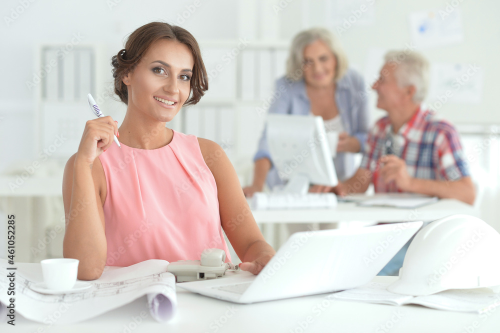Portrait of beautiful young businesswoman architect working in office Portrait of beautiful young businesswoman architect working in office