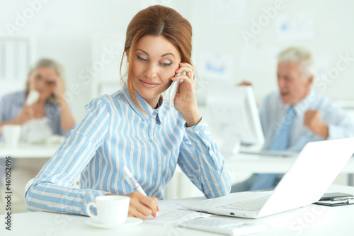 Portrait of group of successful business people in modern office