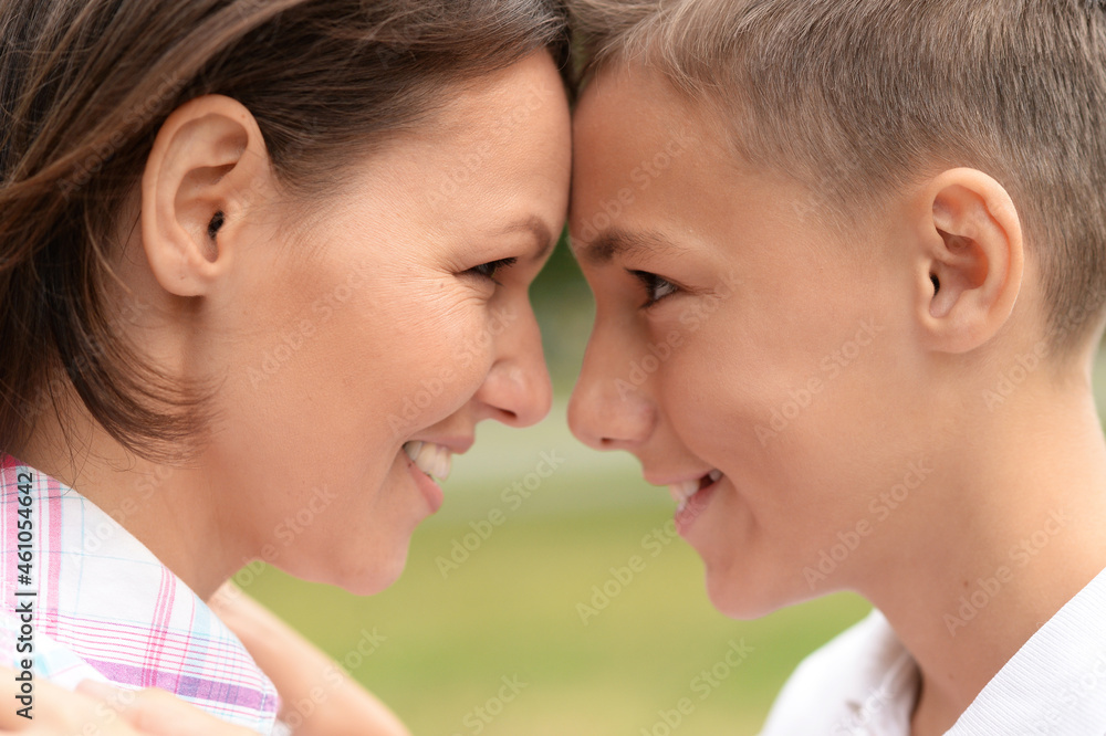 Portrait of beautiful mother with son in park Portrait of beautiful mother with son in park