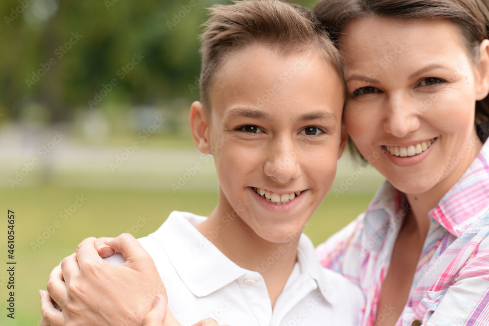 Portrait of beautiful mother with son in park Portrait of beautiful mother with son in park