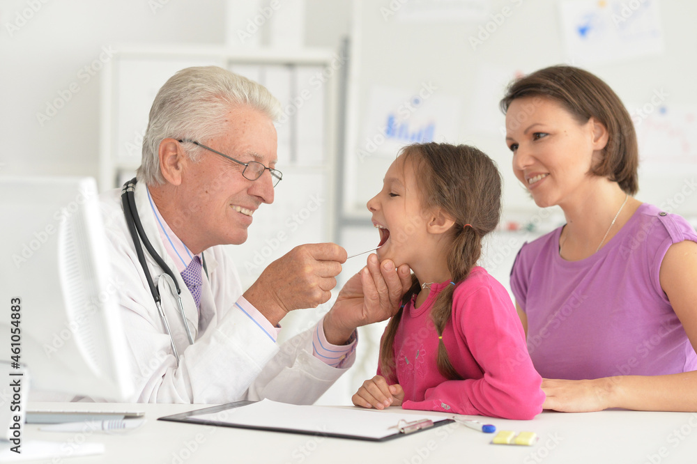 Portrait of young beautiful family visiting doctor in hospital Portrait of young beautiful family visiting doctor in hospital
