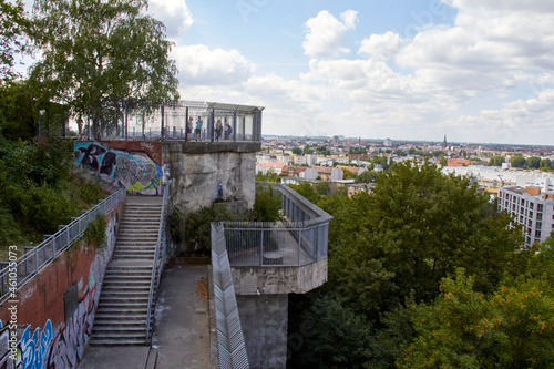 Berlin, Germany, August 5, 2021. View of the city of Berlin from Humboldthain Flak Tower. Sky with clouds, lots of vegetation and Germany's WWII tower.
