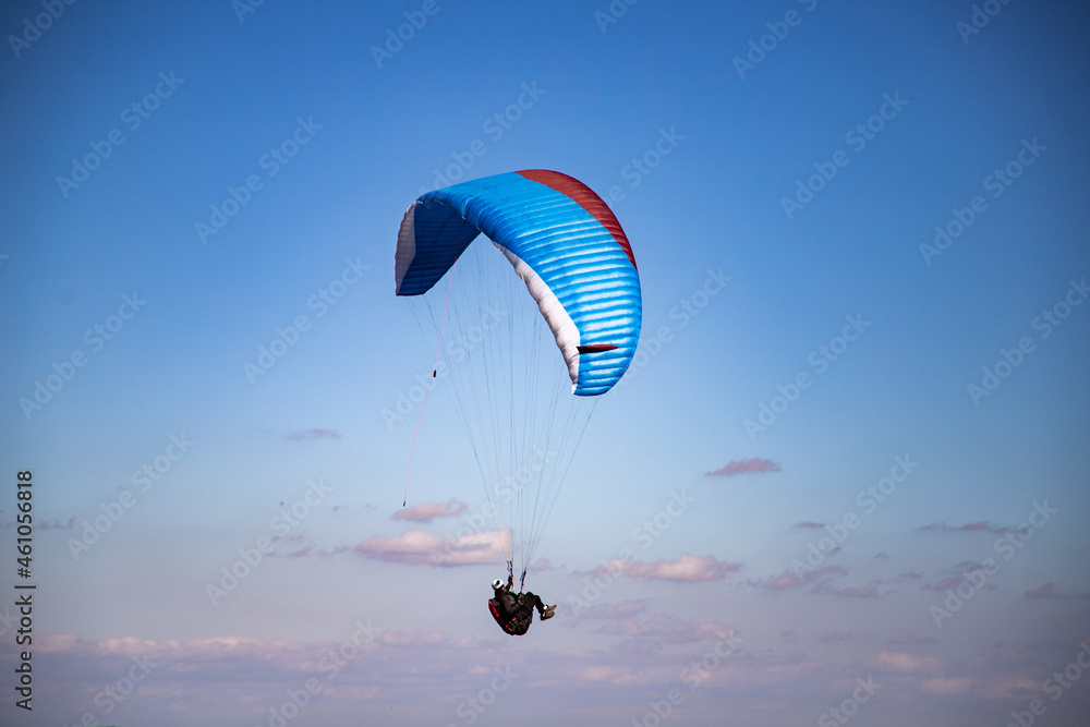 glider paragliding g against blue sky flying  adrenaline and freedom concept