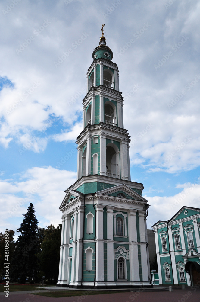 View of the bell tower of the Transfiguration Cathedral. Bell tower on a background of clouds. View of the bell tower of the Transfiguration Cathedral. Bell tower on a background of clouds.