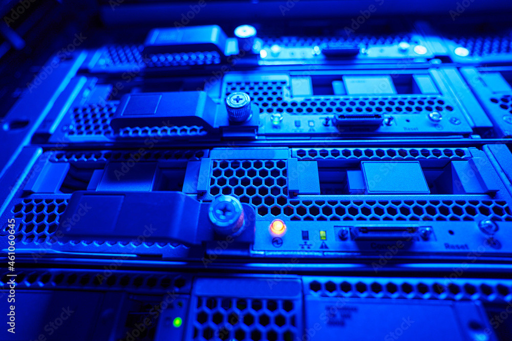 Picture of HDD dicks with yellow indicators in server room Picture of HDD dicks with yellow indicators in server room