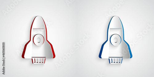 Paper cut Rocket ship icon isolated on grey background. Space travel. Paper art style. Vector