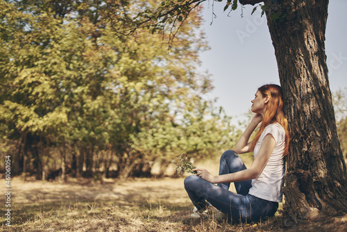 pretty woman sitting near a tree nature Lifestyle summer © SHOTPRIME STUDIO