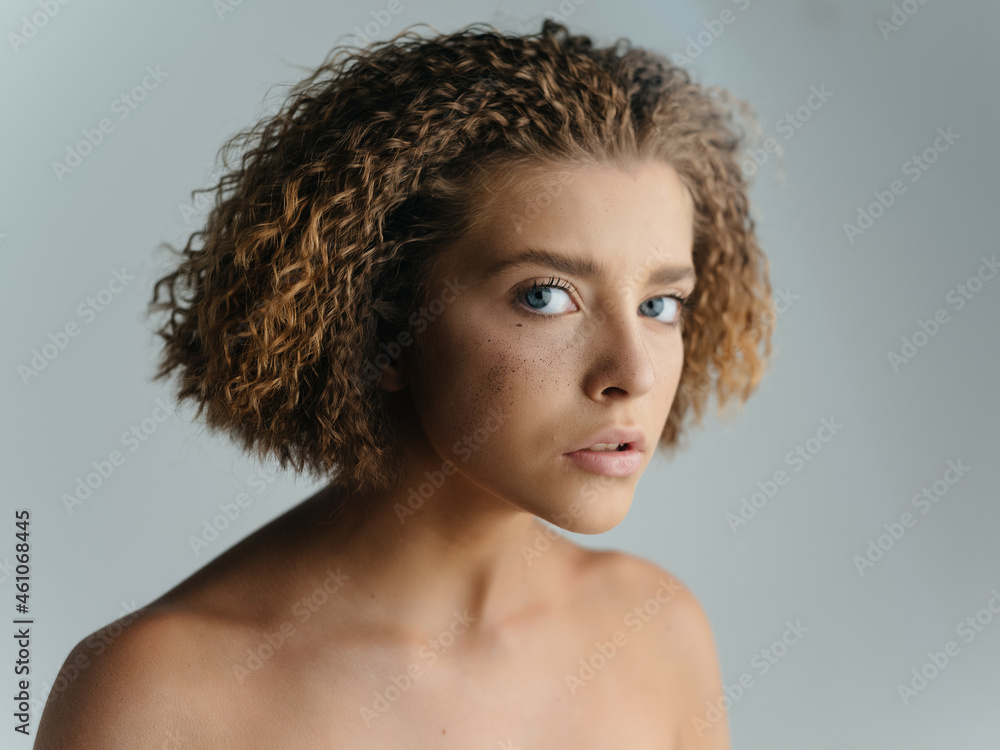 pretty woman naked shoulders curly hair close-up pretty woman naked shoulders curly hair close-up