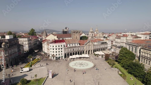 People walking in Braga downtown across the republic square and lapa church photo