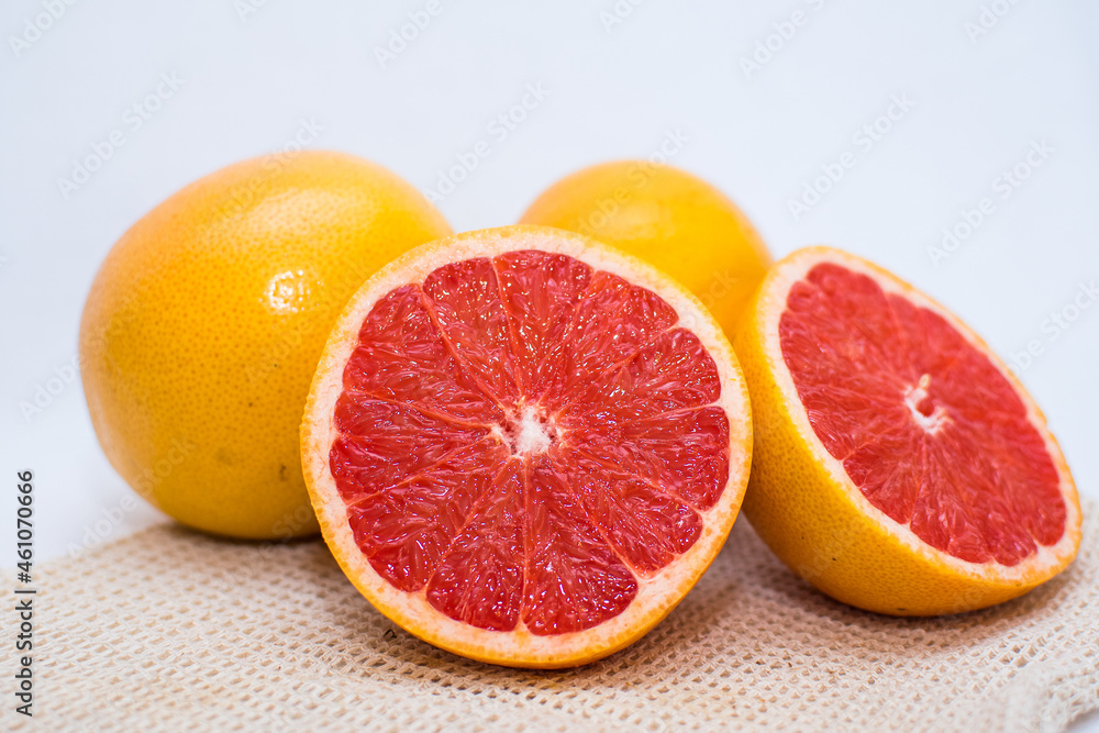 closeup of grapefruit cut in half, in summer, from the organic and healthy store closeup of grapefruit cut in half, in summer, from the organic and healthy store