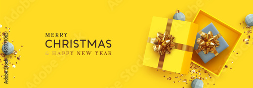Yellow Christmas banner. Xmas Background realistic design open gifts box with surprise, bauble ball 3d render and glitter gold confetti. Horizontal new year poster, greeting card, headers website