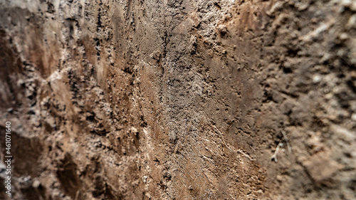 Texture layers of earth. Cross section of brown underground soil layers beneath. Natural cut of soil with different layers