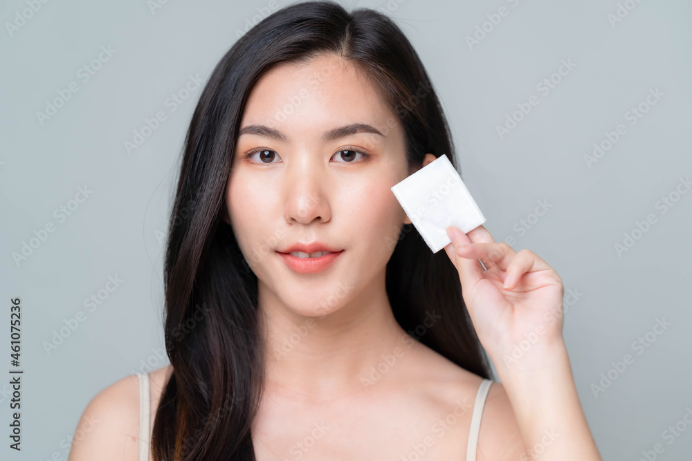 Beautiful young asian woman with clean fresh skin on white background. Asian women portrait. Beautiful young asian woman with clean fresh skin on white background. Asian women portrait.