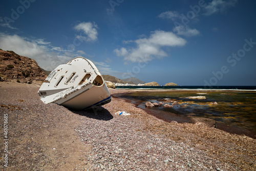 Boat laying on the sand of a beach in Cabo de Gata in Almería