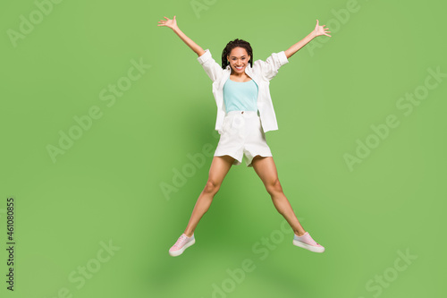 Full length body size photo woman jumping up careless isolated pastel green color background