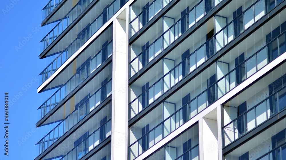 Modern apartment building. Modern urban architecture and details of building facade. Sunlight. Modern apartment building. Modern urban architecture and details of building facade. Sunlight.