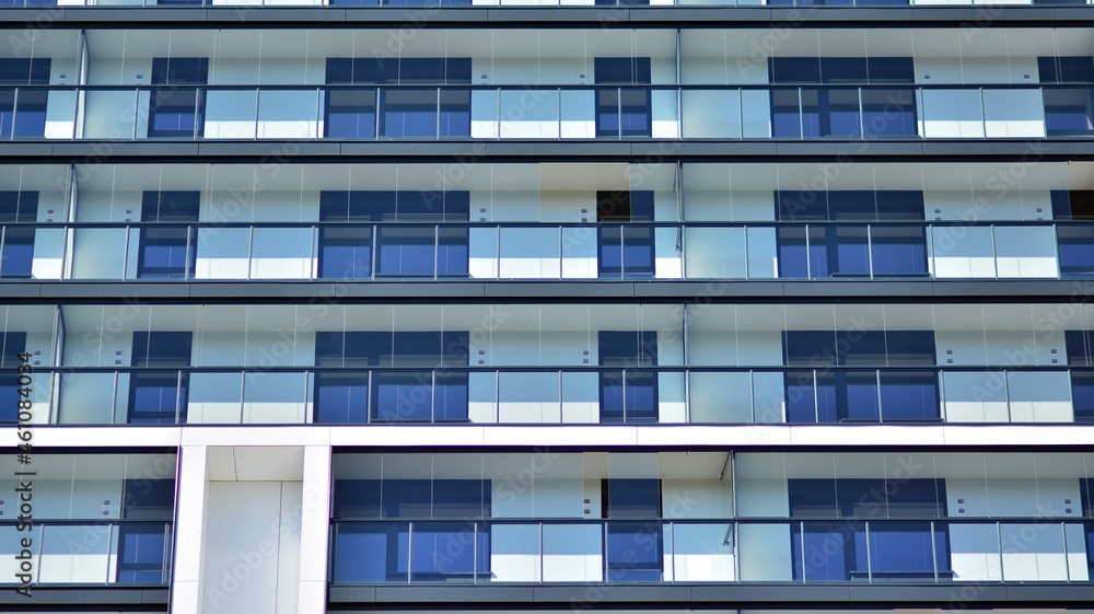 Modern apartment building. Modern urban architecture and details of building facade. Sunlight. Modern apartment building. Modern urban architecture and details of building facade. Sunlight.