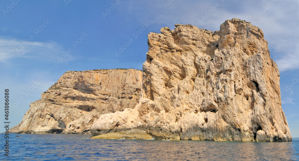 Limestone cliffs of the Capo Caccia cape at the Gulf of Alghero, Sardinia, Italy
