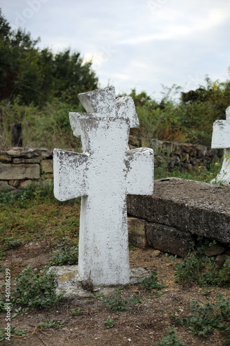Old crosses and monuments in the cemetery. Unknown graves