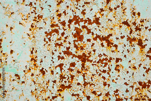 Old rusty metal surface with peeling paint.