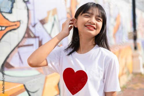 Portrait happy young girl on colorful background. photo