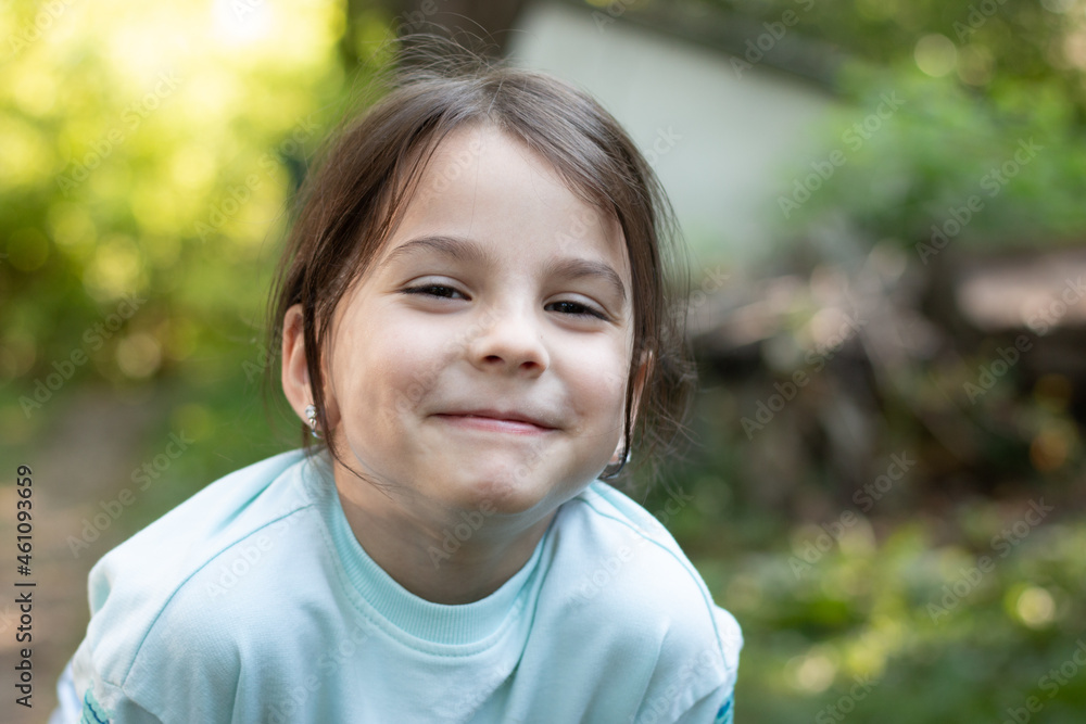 Close-up portrait of little beautiful biracial girl on blurred rustic background with lovely bokeh Close-up portrait of little beautiful biracial girl on blurred rustic background with lovely bokeh