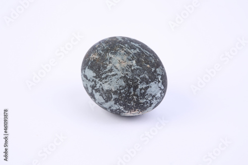 Gray marble painted Easter egg on white background