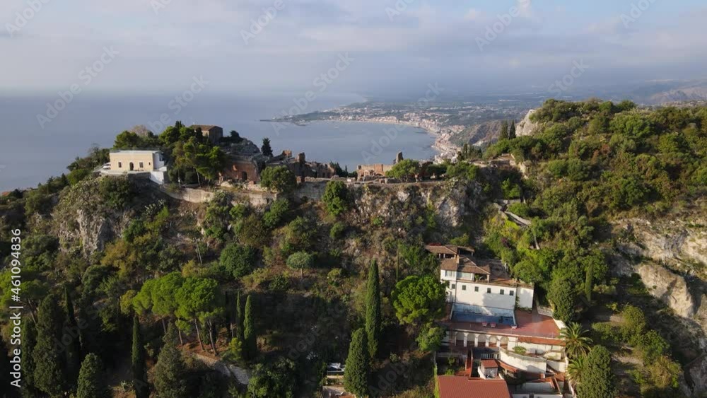 Stunning Panoramic view of the Amphitheatre of Taormina, Italy showcasing the theatre and sea of Sicily.