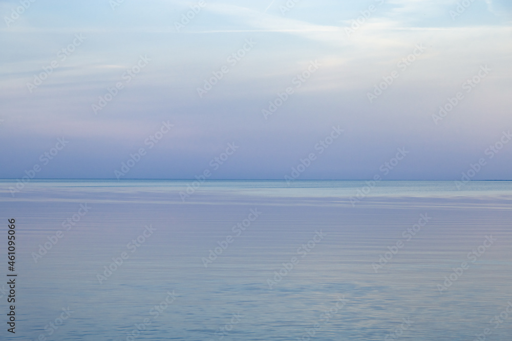 Sky background on sunset, colorful clouds. Nature abstract composition with reflections on sea water. Nature environment. Sky background on sunset, colorful clouds. Nature abstract composition with reflections on sea water. Nature environment.