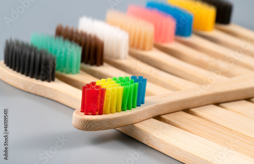 Bamboo toothbrushes on grey background