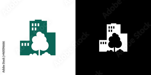 dense tree on the background of a multi-storey building. logo real estate