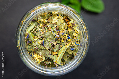 herbal tea medicinal herbs, leaves, flowers linden, chamomile, cornflower, mint, lemon balm, currant, raspberry leaves fresh meal on the table copy space food background rustic 