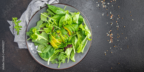 fresh salad avocado leaf mix lettuce  spinach  arugula  chard  lettuce meal snack on the table copy space food background rustic 