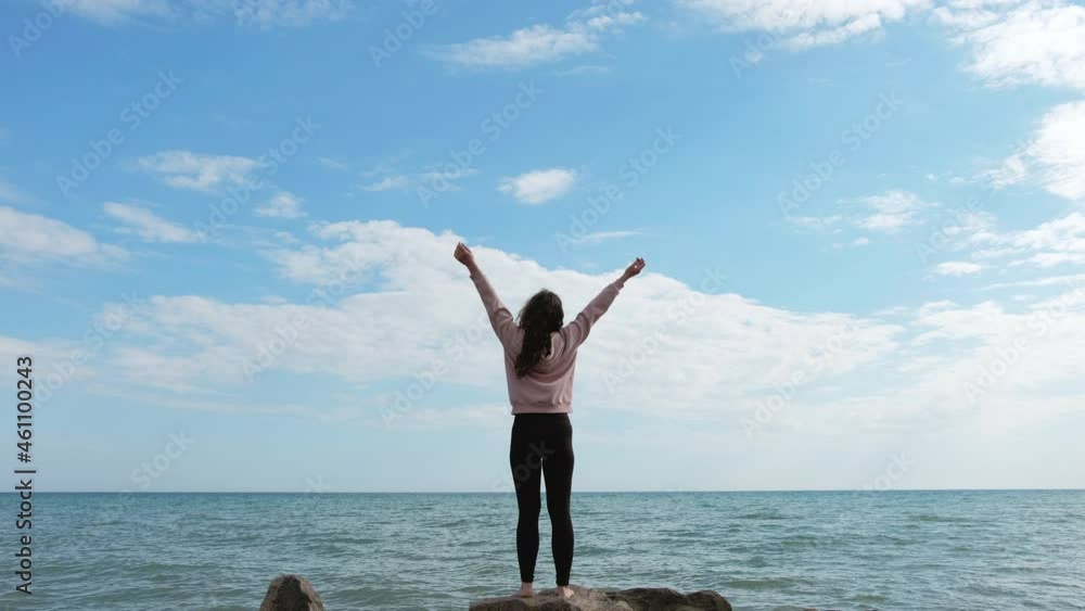 Sea relaxation. Summer vacation. Inner peace. Nature harmony. Back view of peaceful satisfied woman enjoying ocean breeze panoramic beach view with blue sky free space landscape. Sea relaxation. Summer vacation. Inner peace. Nature harmony. Back view of peaceful satisfied woman enjoying ocean breeze panoramic beach view with blue sky free space landscape.