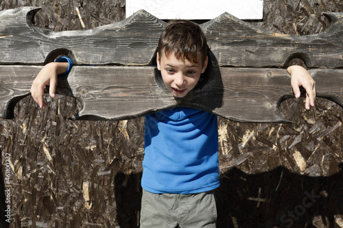 Fototapeta Boy in wooden pillory