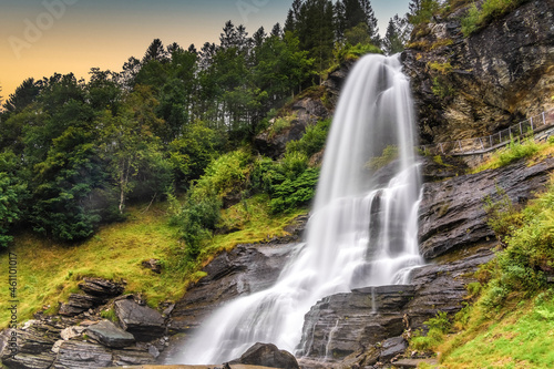 Steinsdalsfossen (also Øvsthusfossen or Øfsthusfossen) a waterfall in the village of Steine in Kvam, Vestland, Norway photo