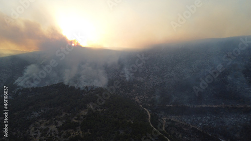 Summer forest fires. Smoke of a forest fire obscures the sun. Natural disasters. Aerial view