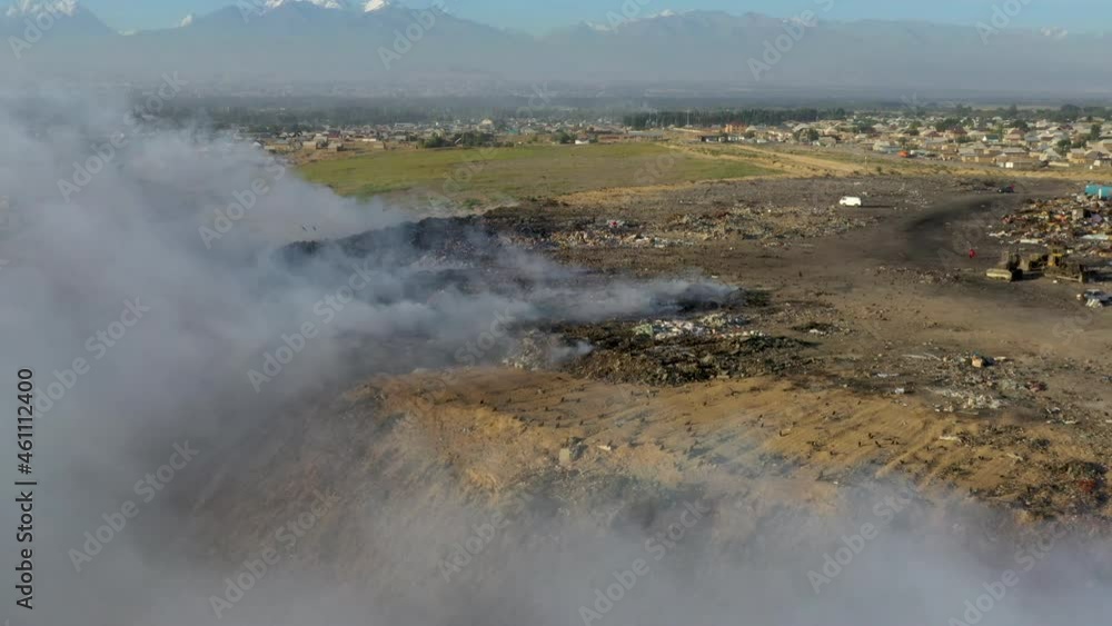 Aerial view of burning landfill with full of waste Aerial view of burning landfill with full of waste