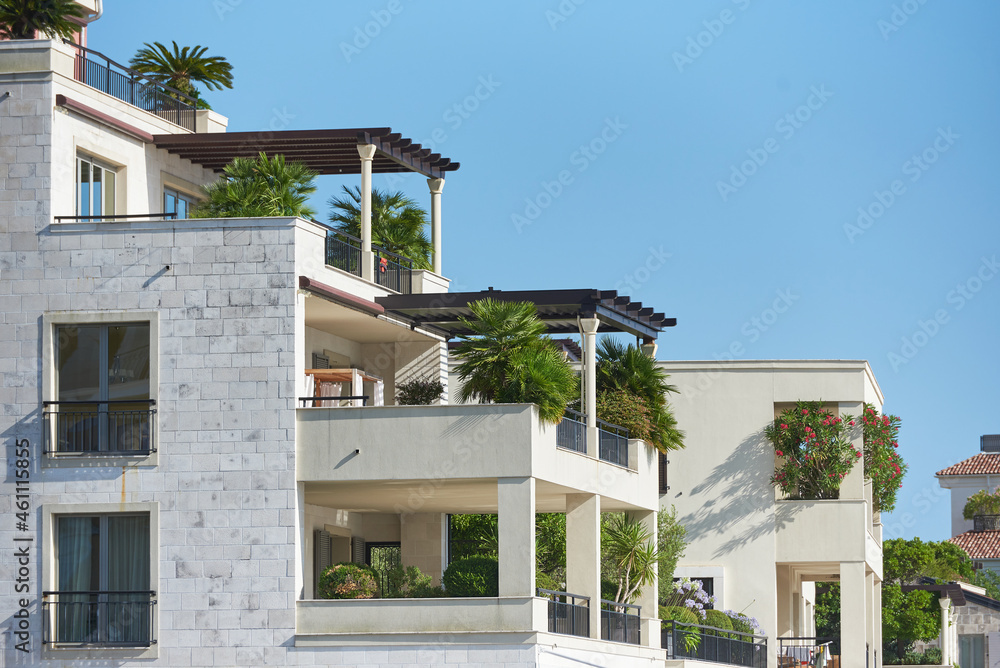 Roof patio with plants decoration on modern residential building in European city