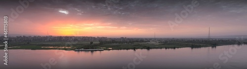 Panorama sunset scene from Sohag city in south Egypt showing Qaraman island which overlooks the Nile river